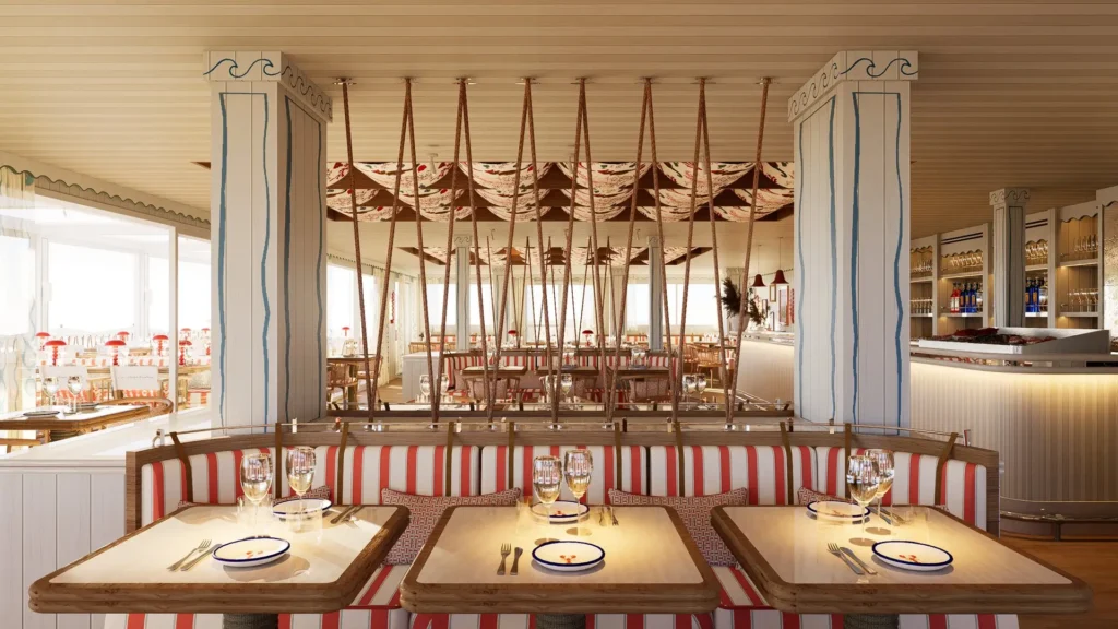 Salle principale du restaurant avec banquettes rayées rouge et blanc, tables en bois et cordages suspendus au plafond